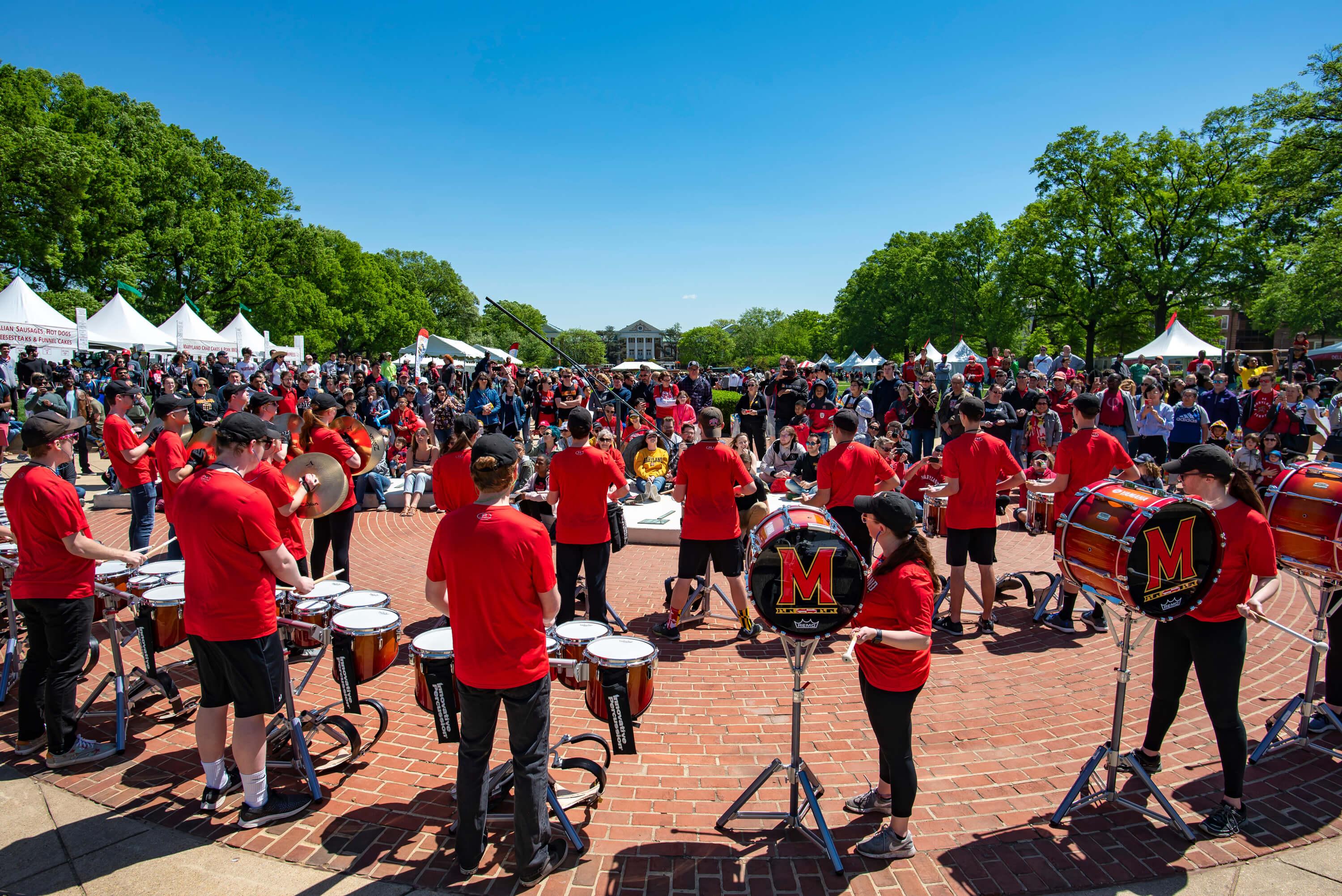 University band playing to crowd on campus during Maryland day