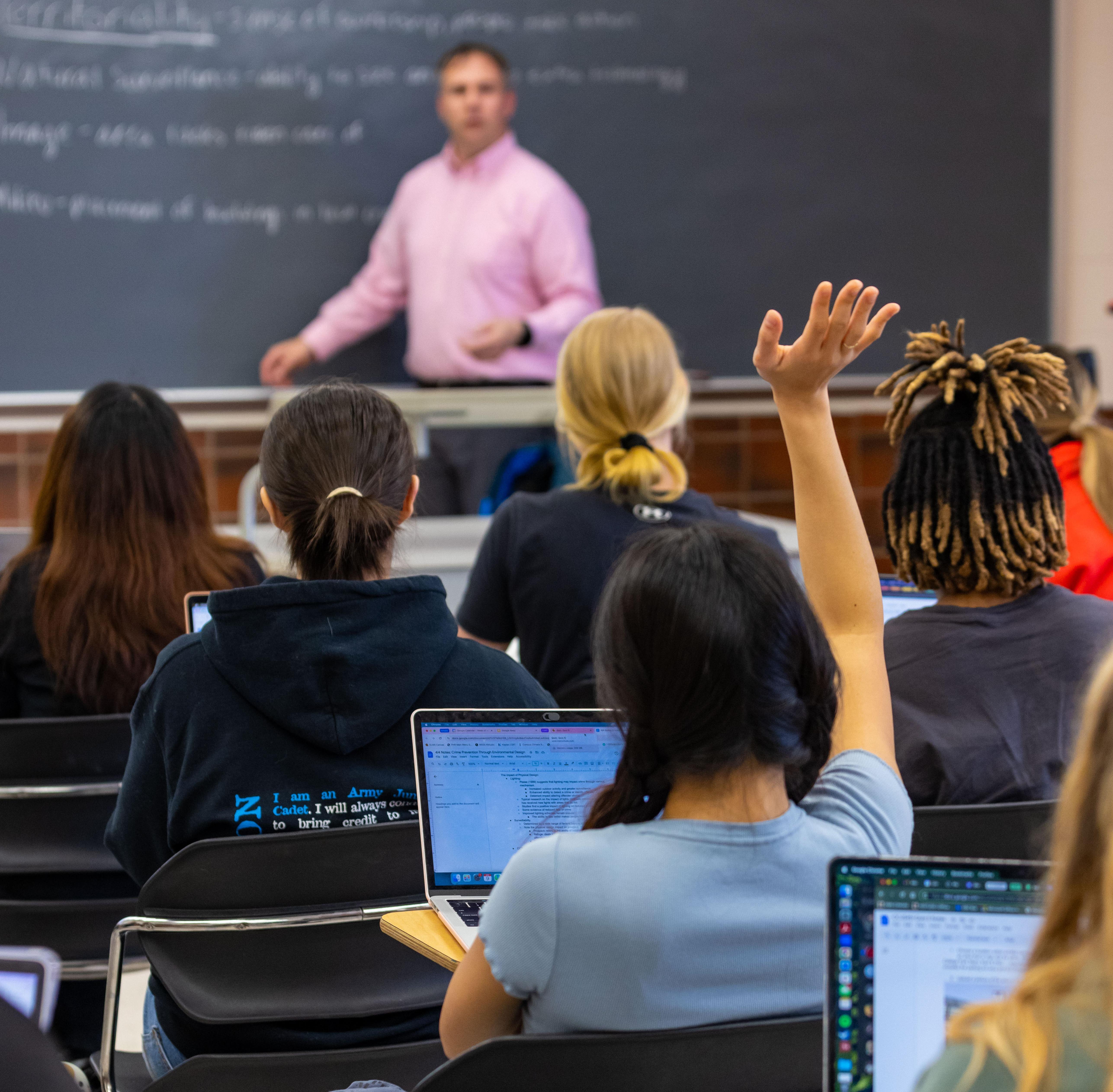 Student raising had in UMD class