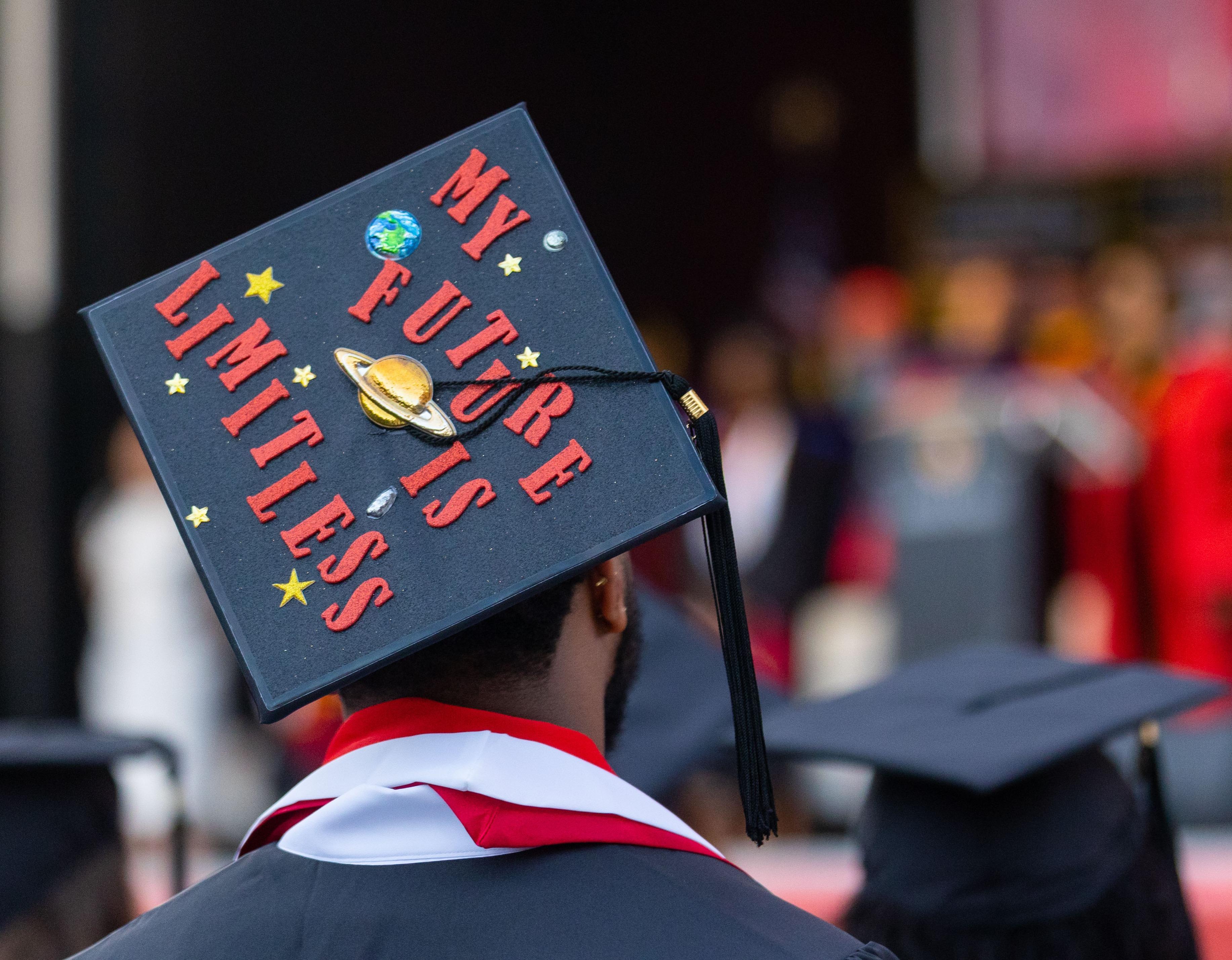 Commencement 2024 with cap that says "My future is limitless"